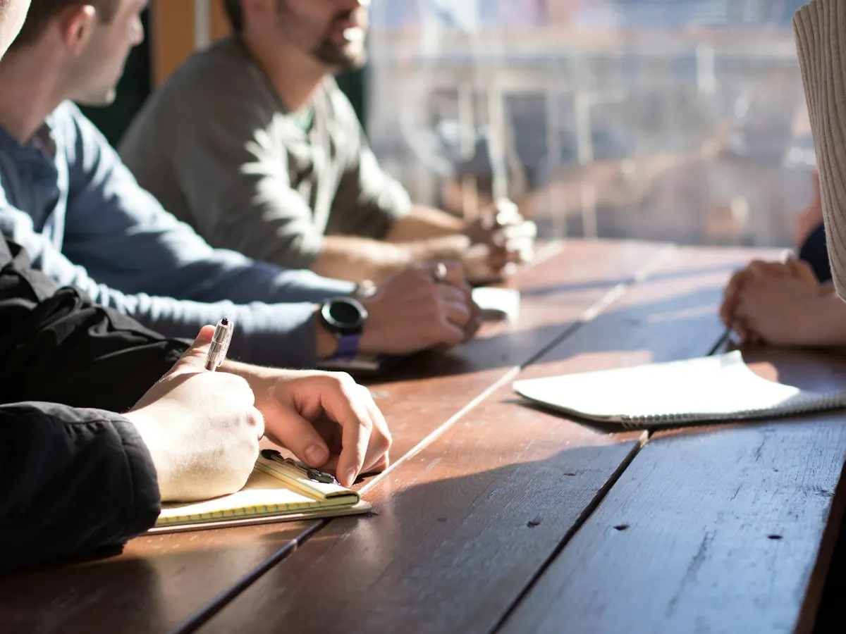 People working together at a long table